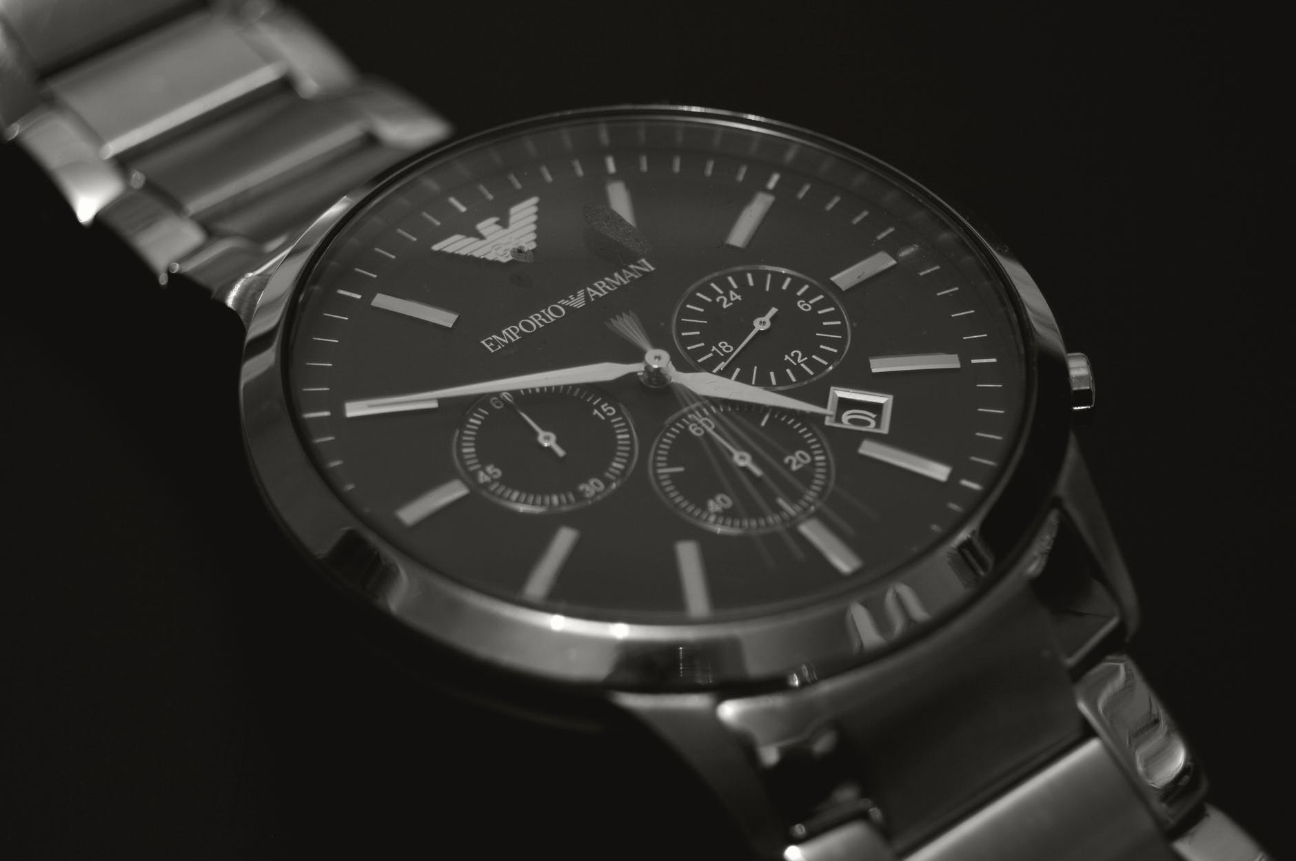 round silver colored emporio armani chronograph watch