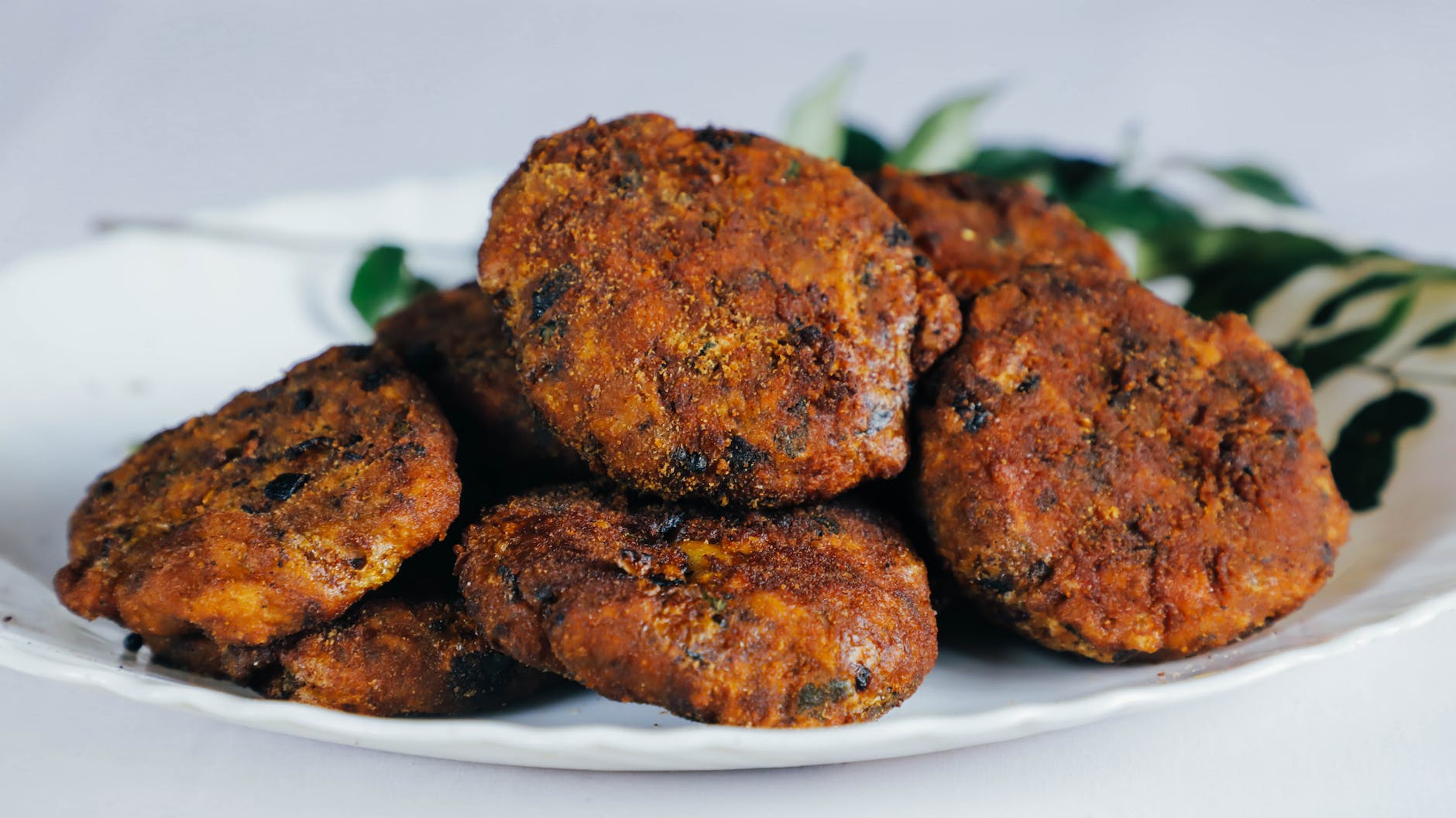 cutlets on a white ceramic plate frikadellen