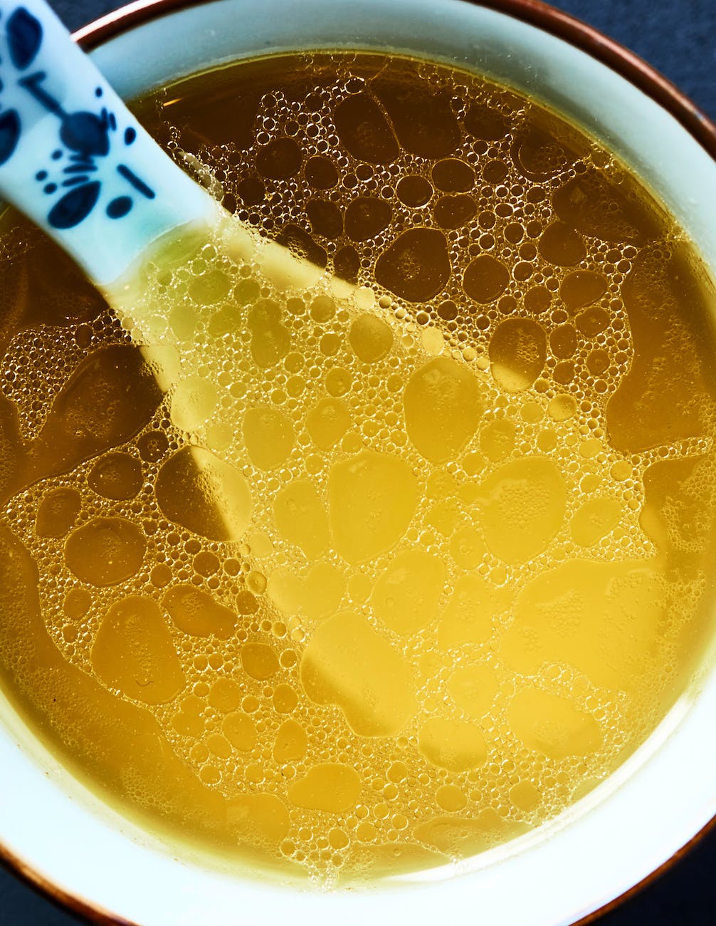 close up of a chicken soup in a bowl hühnerbrühe hühnersuppe