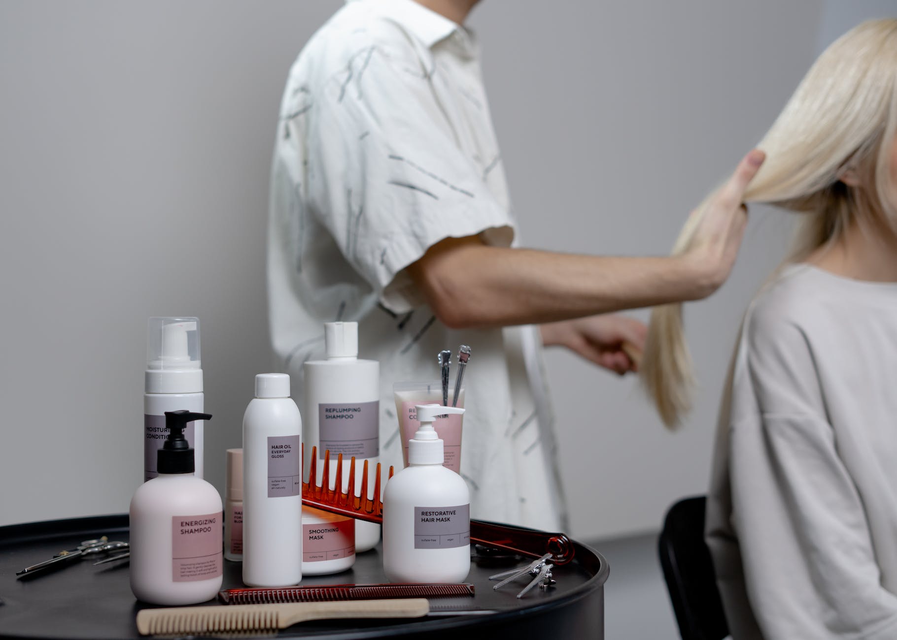 a hair dresser servicing a customer